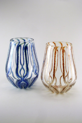 Individually hand blown drinking glasses(not mass produced). Clear with blue or gold lusters. Holds 12 oz.