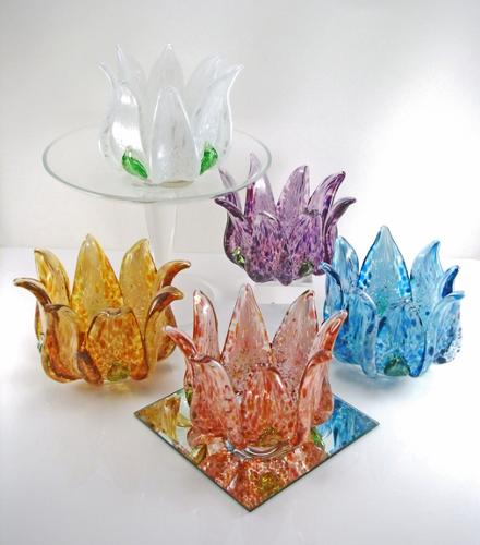 Lotus shaped tea light candle holders. Solid sculpted hot glass. Approx. 4"x 3" round.